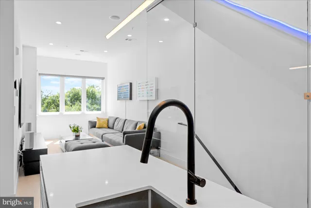 a kitchen with a refrigerator and white cabinets