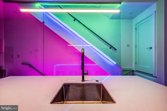 a view of a pool red grass and red umbrella