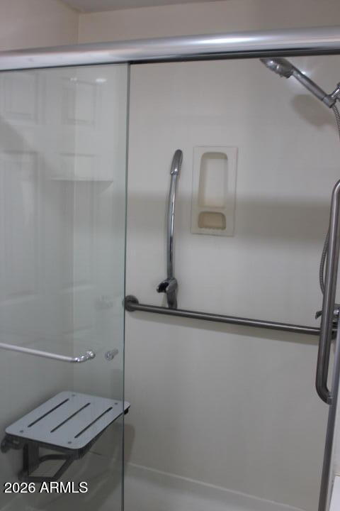 303 South Recker Road, Unit 128 Mesa, AZ 85206 - Photo 18 of 26 a bathroom with a shower and toilet