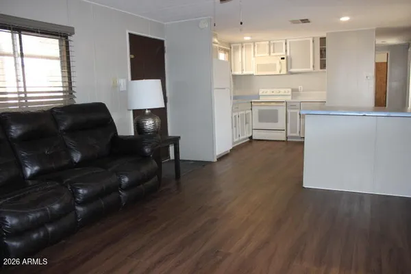 a kitchen with a stove top oven sink and cabinets