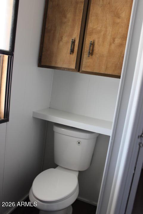 303 South Recker Road, Unit 128 Mesa, AZ 85206 - Photo 10 of 26 a white toilet sitting next to a sink