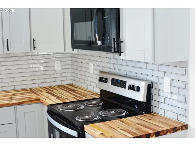 a kitchen with a stove and a sink