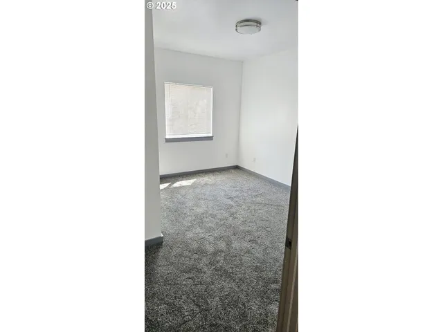 a view of a room with windows