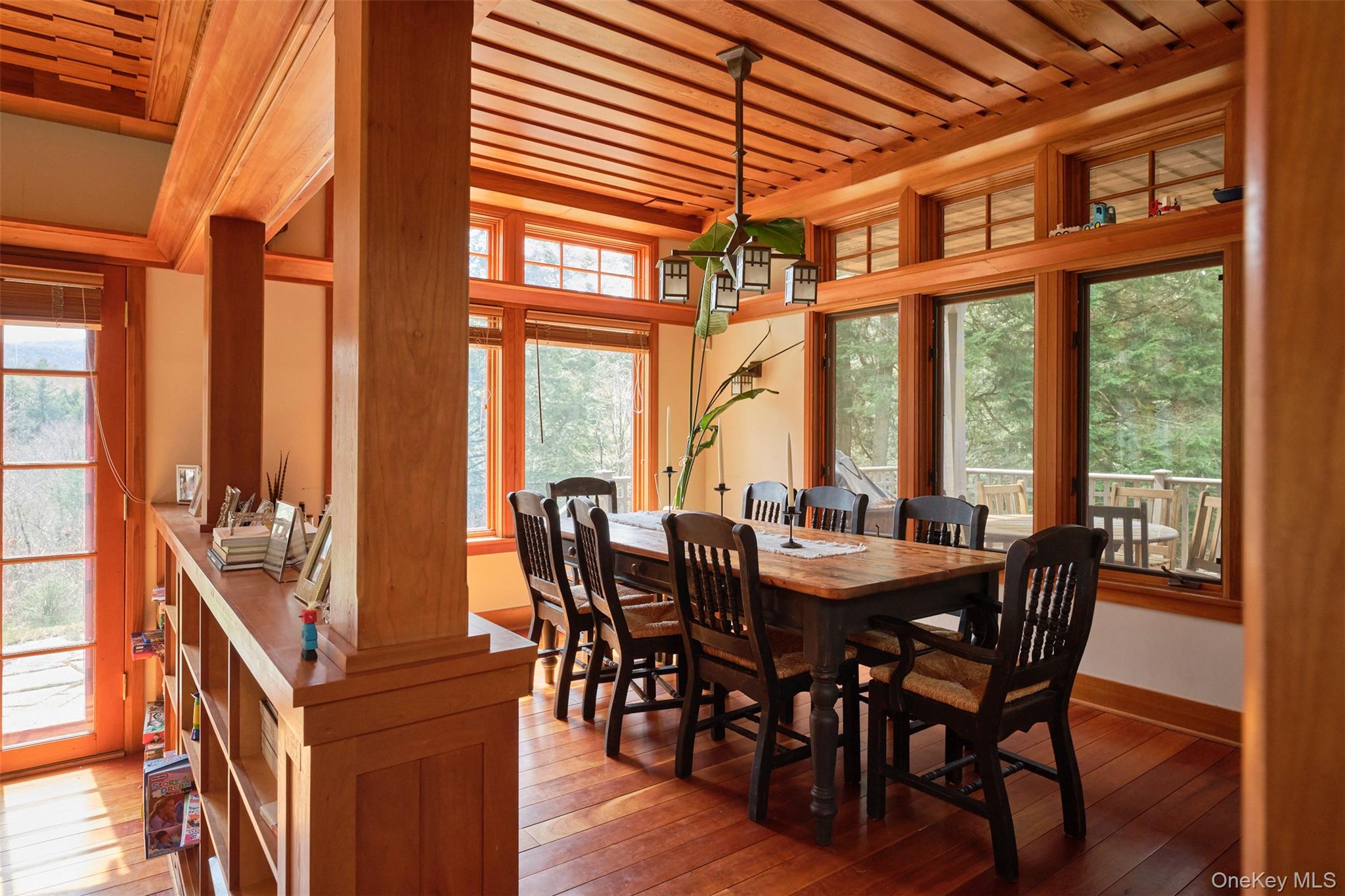 74 High Meadow Road Livingston Manor, NY 12758 - Photo 7 of 41 a view of a dining room with furniture large windows and wooden floor