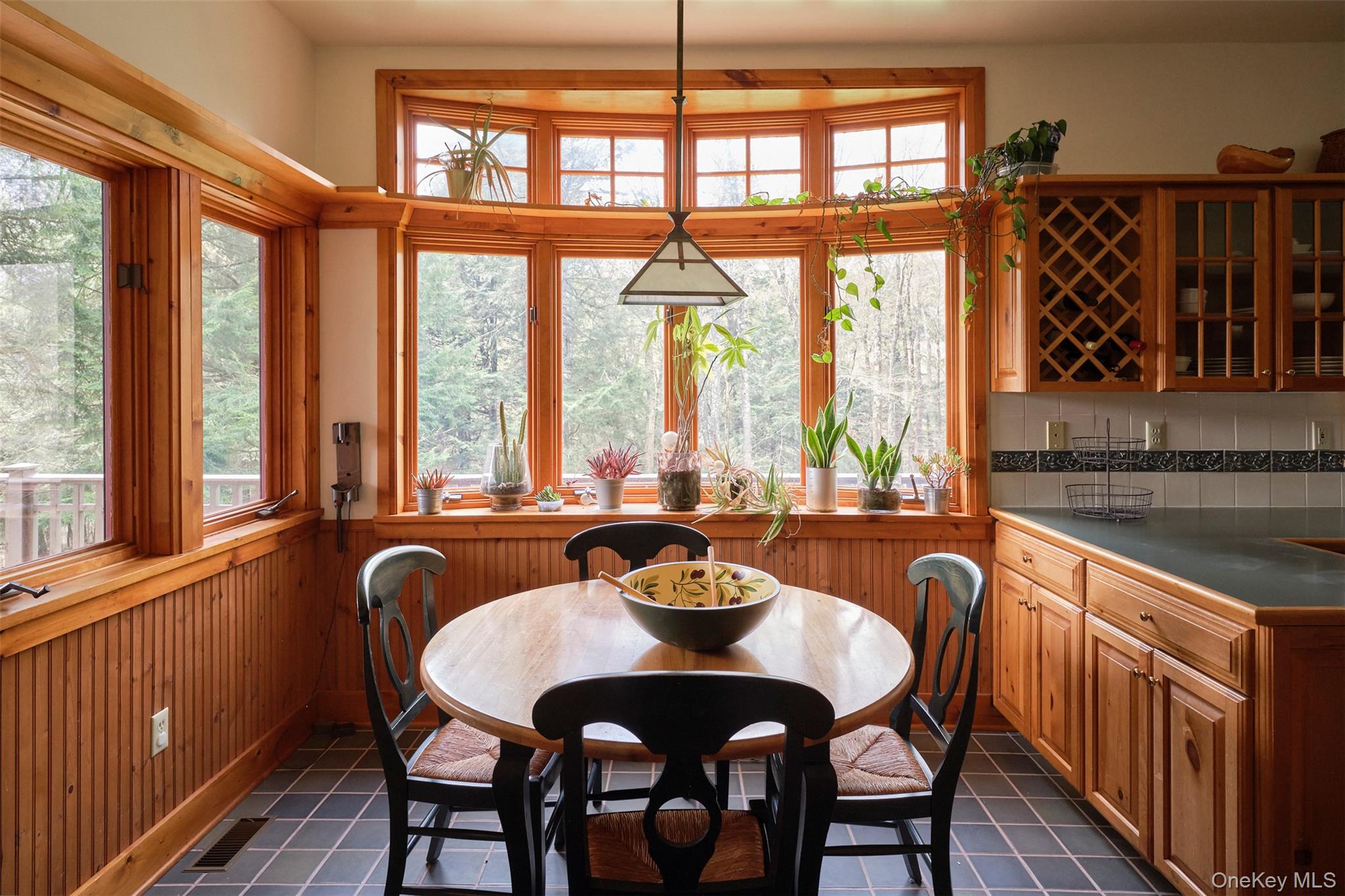 74 High Meadow Road Livingston Manor, NY 12758 - Photo 10 of 41 a dining room with furniture a chandelier and wooden floor