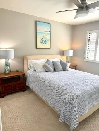 a bedroom with bed and window