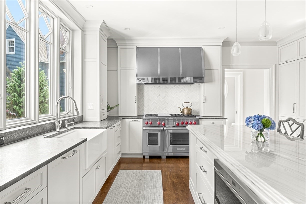 5 Stratford Road Winchester, MA 01890 - Photo 12 of 39 a kitchen with a sink stove and cabinets