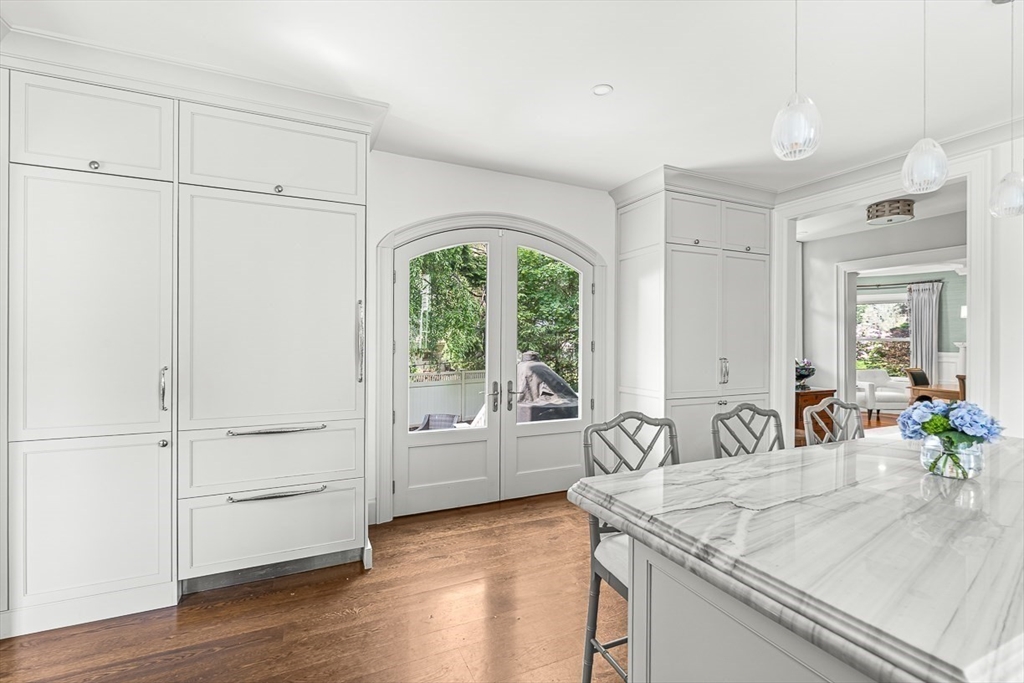5 Stratford Road Winchester, MA 01890 - Photo 16 of 39 a view of a kitchen island wooden floor and windows