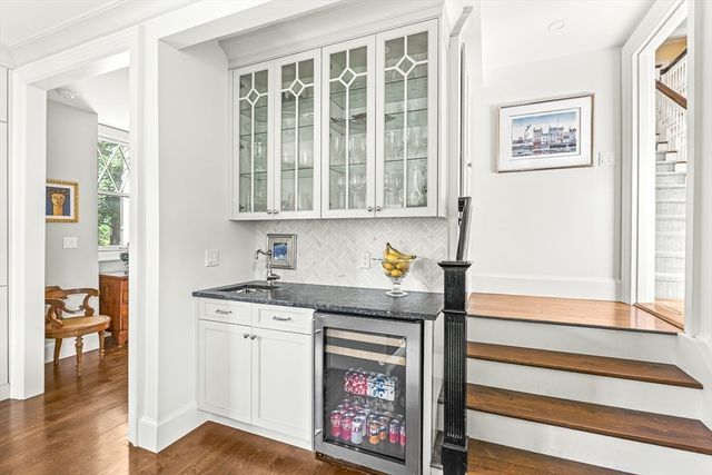a kitchen with stainless steel appliances granite countertop a stove and a window