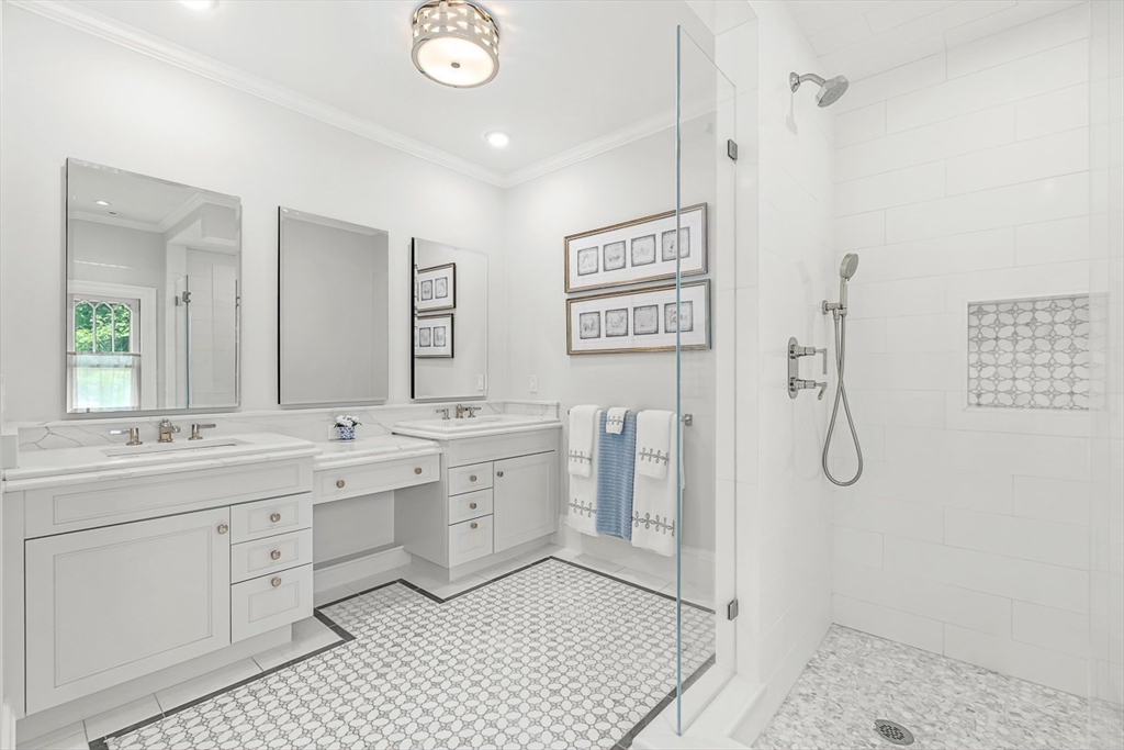 5 Stratford Road Winchester, MA 01890 - Photo 22 of 39 a spacious bathroom with a double vanity sink a mirror a shower and a window