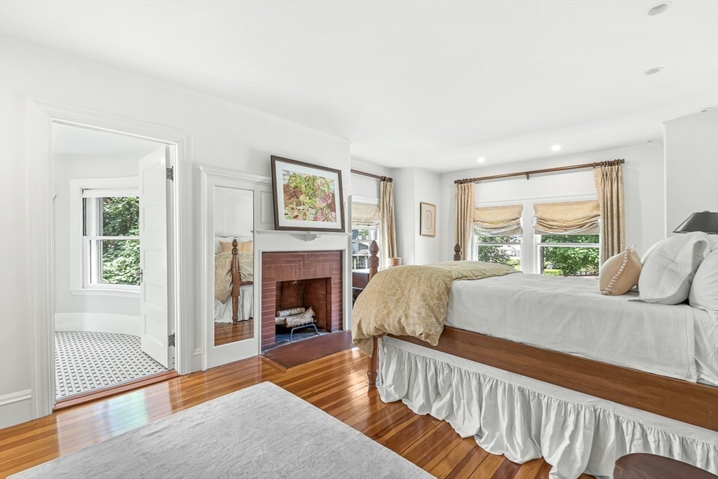 5 Stratford Road Winchester, MA 01890 - Photo 23 of 39 a living room with furniture and a fireplace