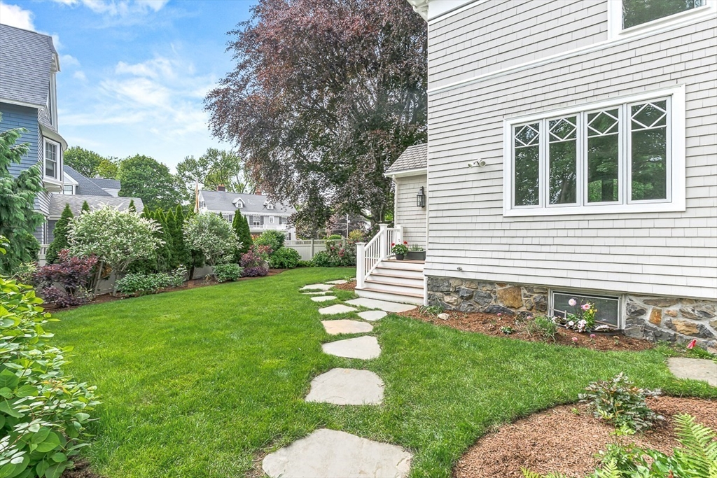 5 Stratford Road Winchester, MA 01890 - Photo 34 of 39 a view of a house with a yard and a garden
