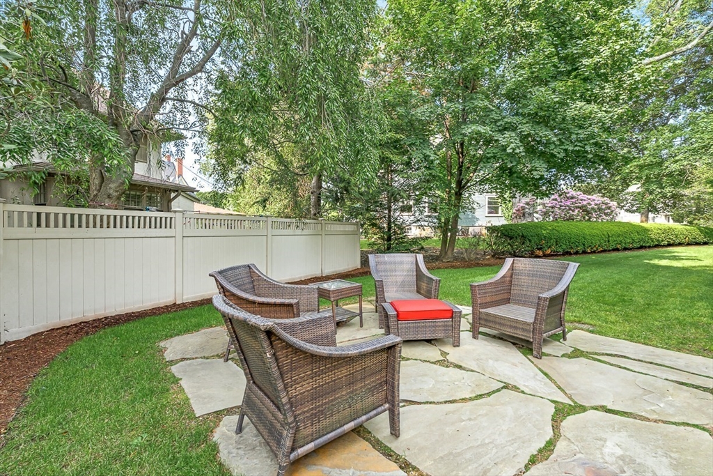 5 Stratford Road Winchester, MA 01890 - Photo 36 of 39 a backyard of a house with table and chairs
