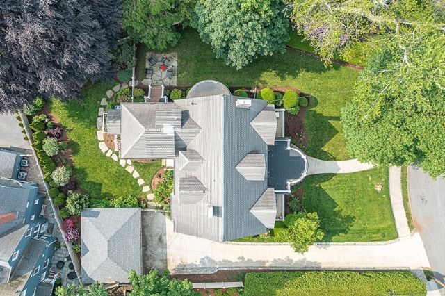 an aerial view of a house with outdoor space