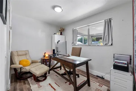 a workspace with furniture and window