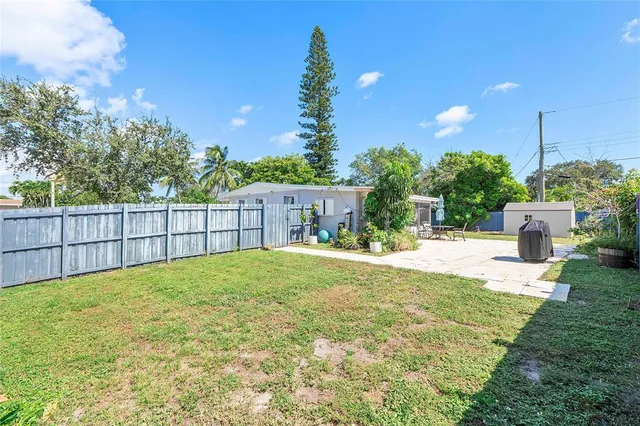 a view of a backyard of the house