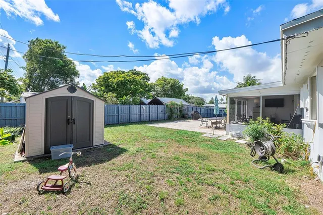 a view of a backyard with a garden and plants