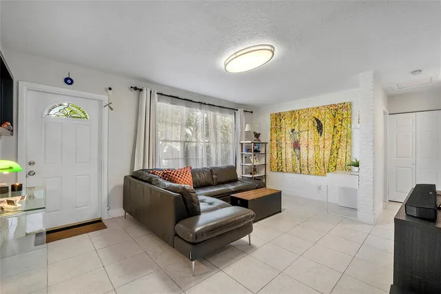a living room with furniture and a window