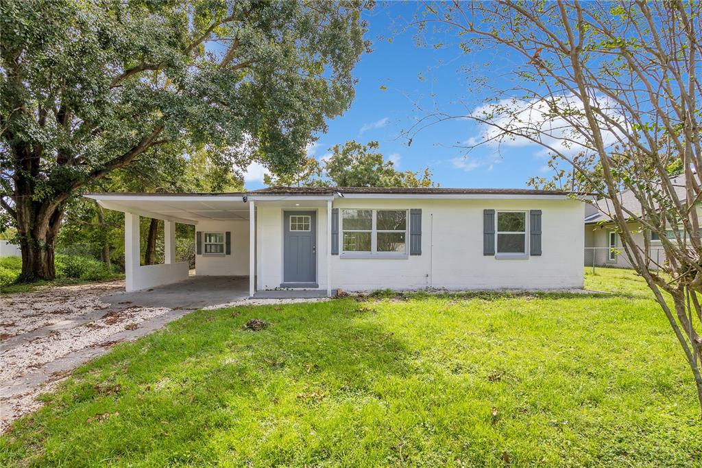 3704 Wells Street Orlando, FL 32805 - Photo 1 of 1 front view of a house with a big yard