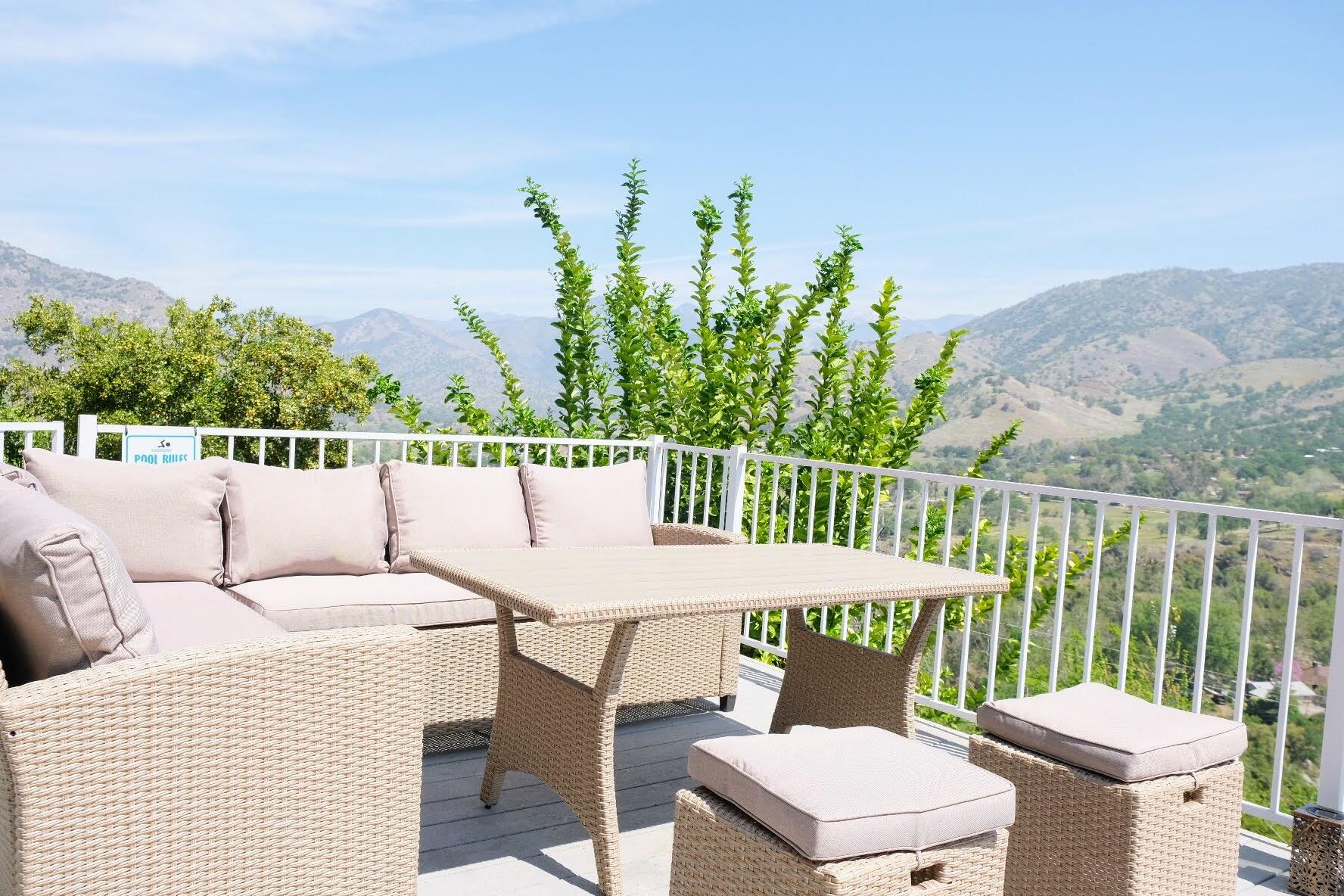 40637 Crystal Drive Three Rivers, CA 93271 - Photo 25 of 32 a roof deck with a table and chairs with wooden floor and fence