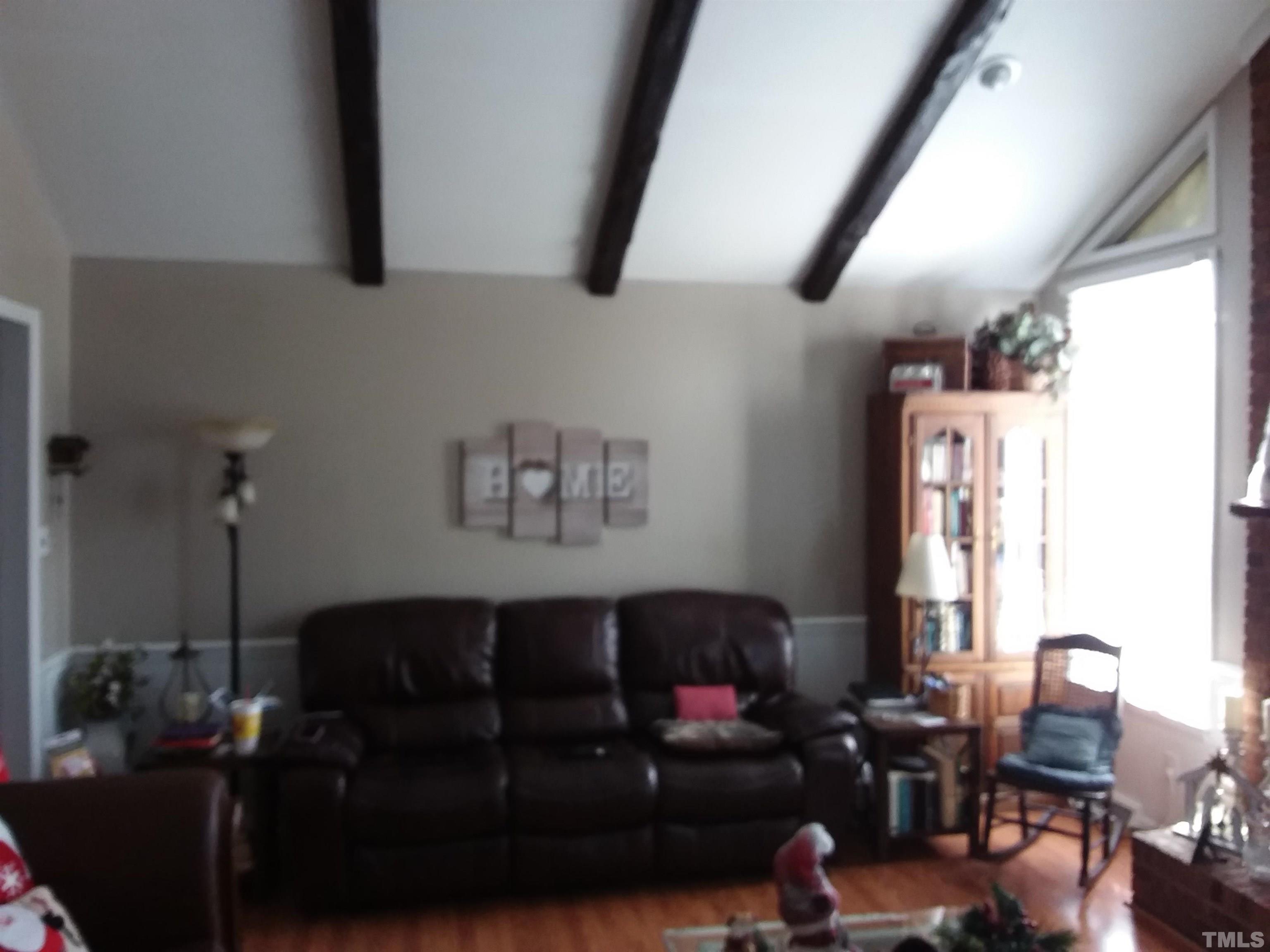 5029 Hurmax Lane Raleigh, NC 27610 - Photo 10 of 52 cathedral ceiling , room has masonry fireplace