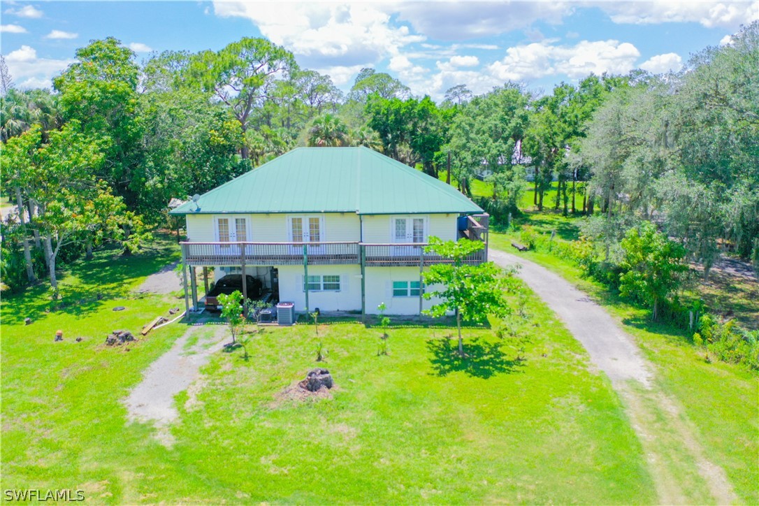 4050 Staley Road Fort Myers, FL 33905 - Photo 1 of 25 a view of a house with swimming pool and garden