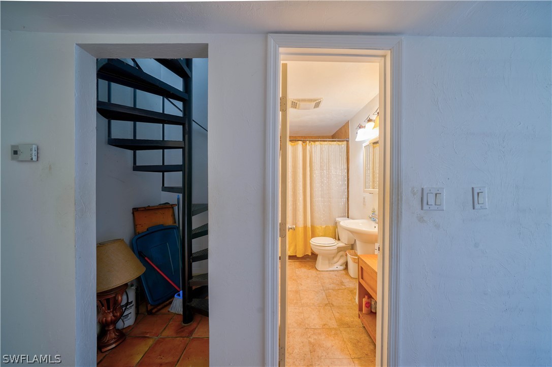 4050 Staley Road Fort Myers, FL 33905 - Photo 12 of 25 a view of a hallway with toilet and a room