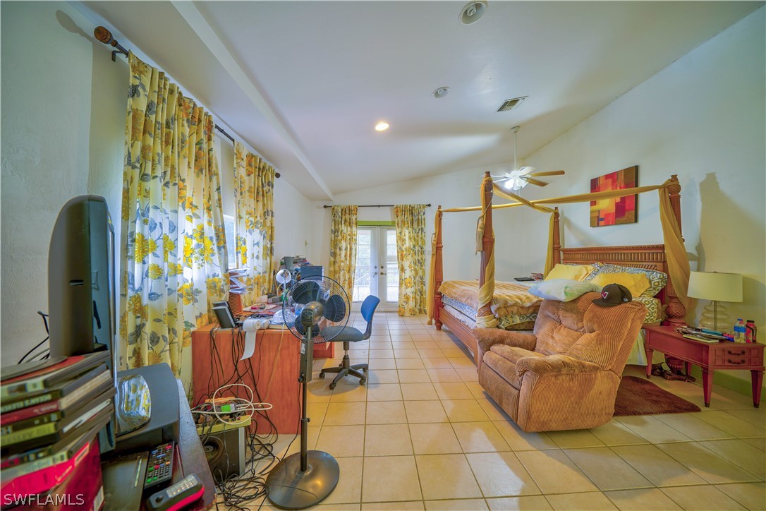 4050 Staley Road Fort Myers, FL 33905 - Photo 14 of 25 a living room with fireplace furniture and a flat screen tv