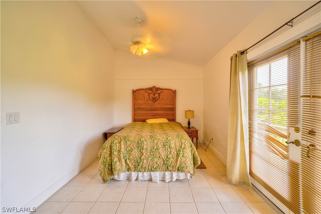 4050 Staley Road Fort Myers, FL 33905 - Photo 15 of 25 a bed sitting in a bedroom next to a window