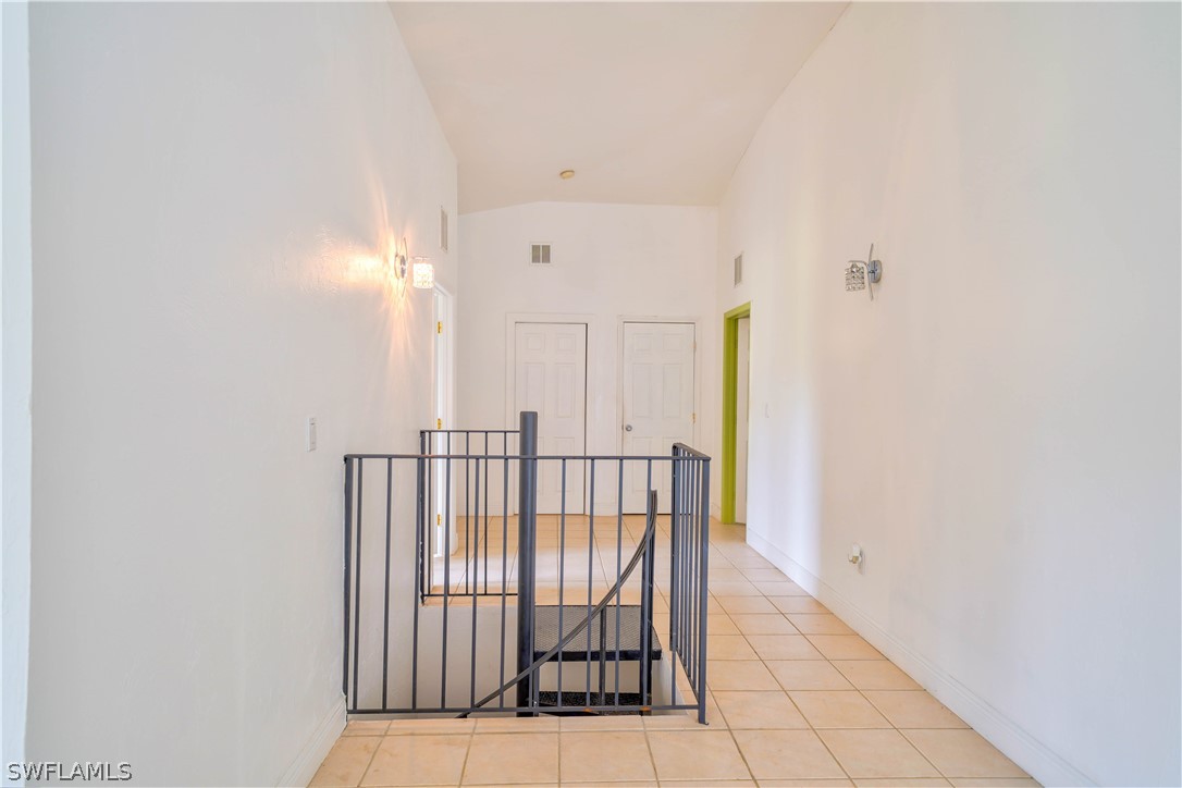 4050 Staley Road Fort Myers, FL 33905 - Photo 18 of 25 a view of staircase with railing and a rug