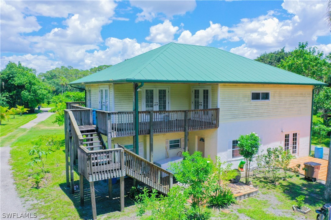 4050 Staley Road Fort Myers, FL 33905 - Photo 2 of 25 a front view of a house with garden