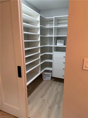 a view of an empty room with empty shelves