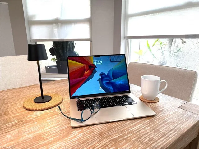 a living room with a table and white walls