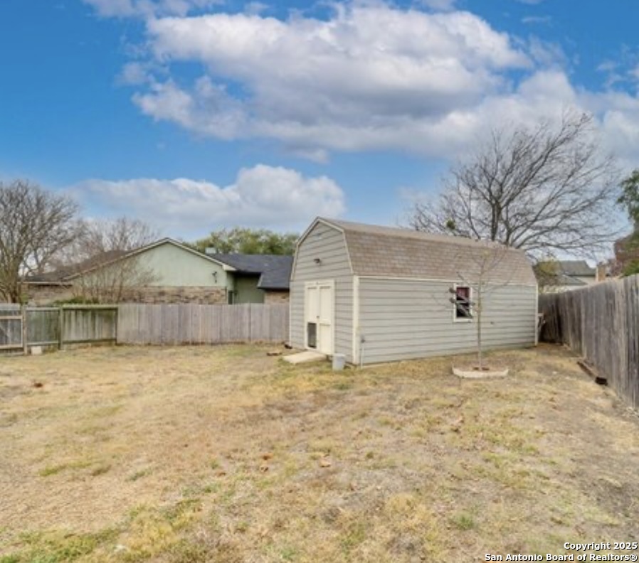 15022 Baycliff San Antonio, TX 78233 - Photo 13 of 15 a view of a house with a yard