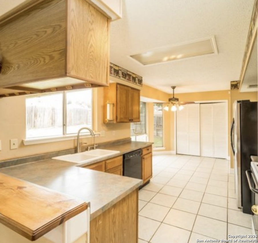 15022 Baycliff San Antonio, TX 78233 - Photo 2 of 15 a large white kitchen with a large window