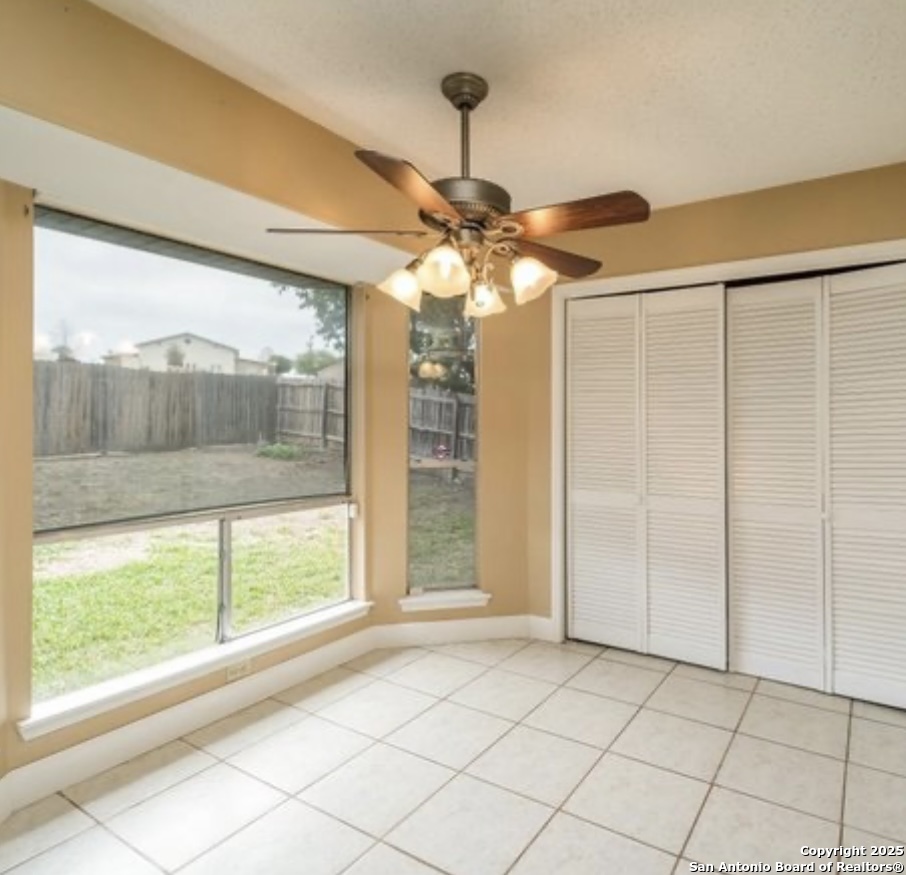 15022 Baycliff San Antonio, TX 78233 - Photo 3 of 15 a view of a livingroom with a chandelier fan and a window