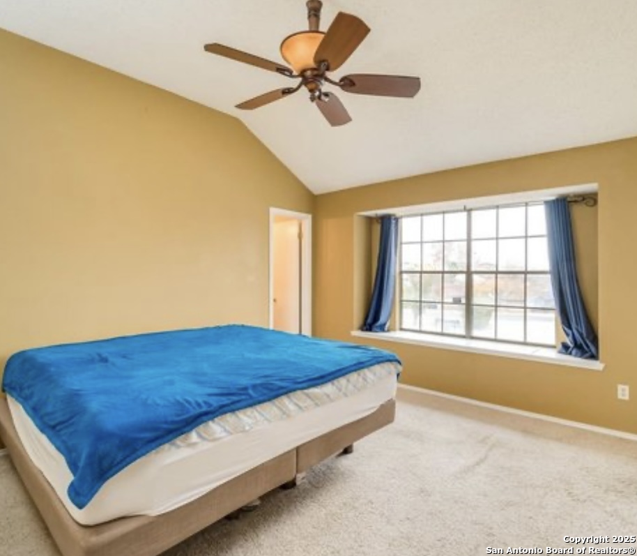 15022 Baycliff San Antonio, TX 78233 - Photo 10 of 15 a bed sitting in a bedroom next to a window