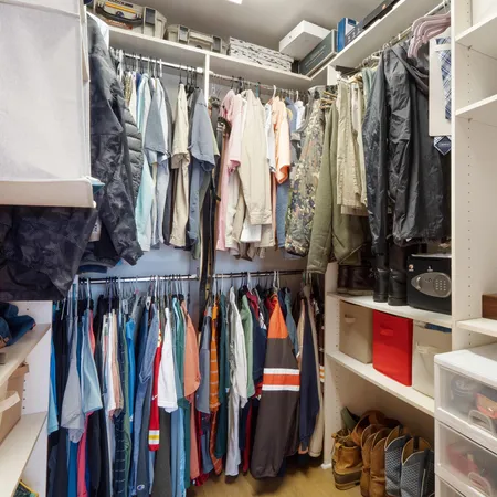a spacious bathroom with a granite countertop sink and a bathtub