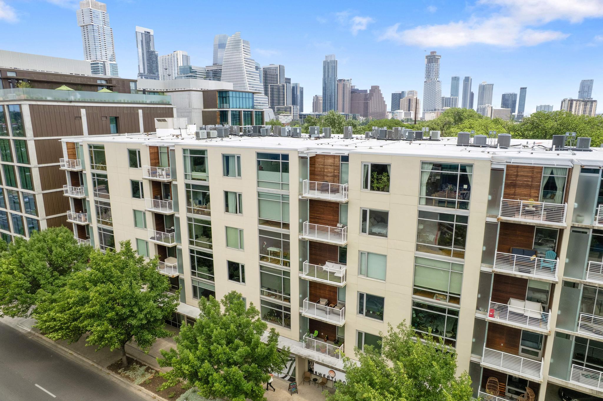 210 Lee Barton Drive, Unit 415 Austin, TX 78704 - Photo 19 of 22 View of building exterior with a view of city