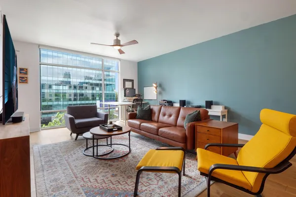 a kitchen with stainless steel appliances a stove a sink and a refrigerator
