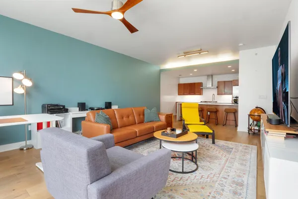 a kitchen with a sink a counter space and cabinets