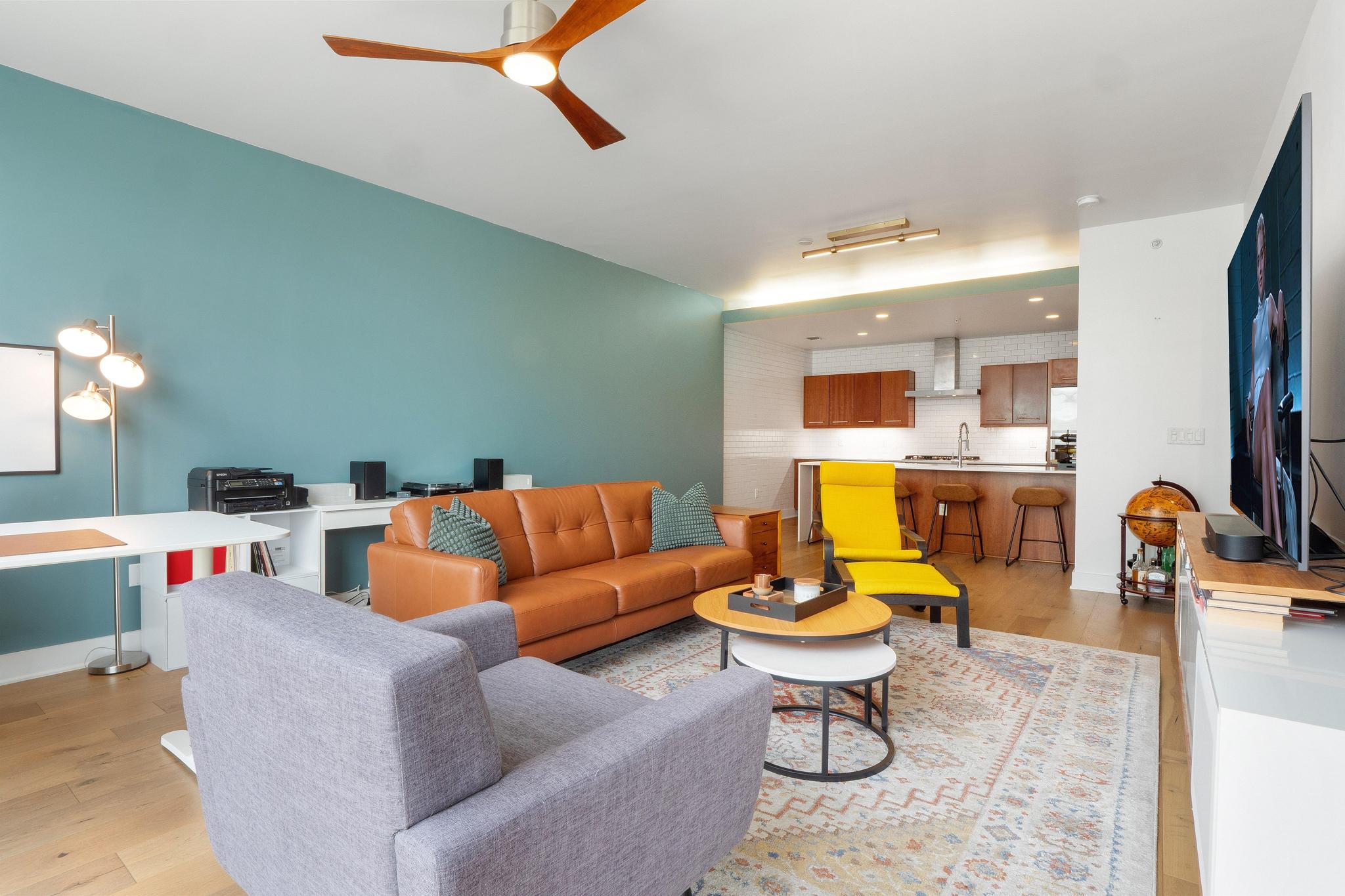 210 Lee Barton Drive, Unit 415 Austin, TX 78704 - Photo 3 of 22 Living room with ceiling fan and light wood-type flooring