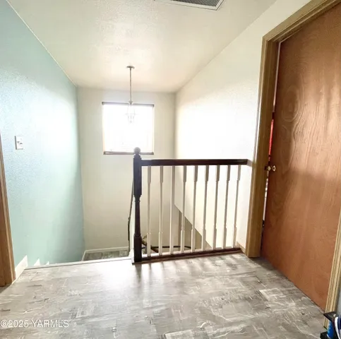 a view of entryway with wooden floor