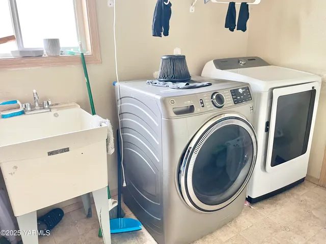 a utility room with dryer and washer