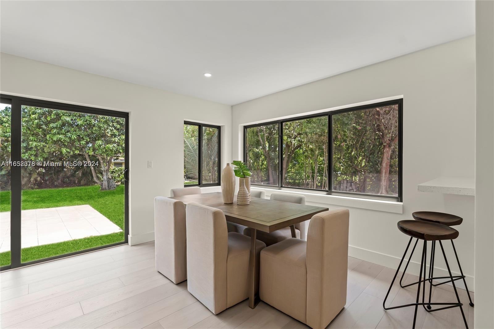 151 Northwest 146th Street Miami, FL 33168 - Photo 13 of 35 a kitchen with a sink and a large window