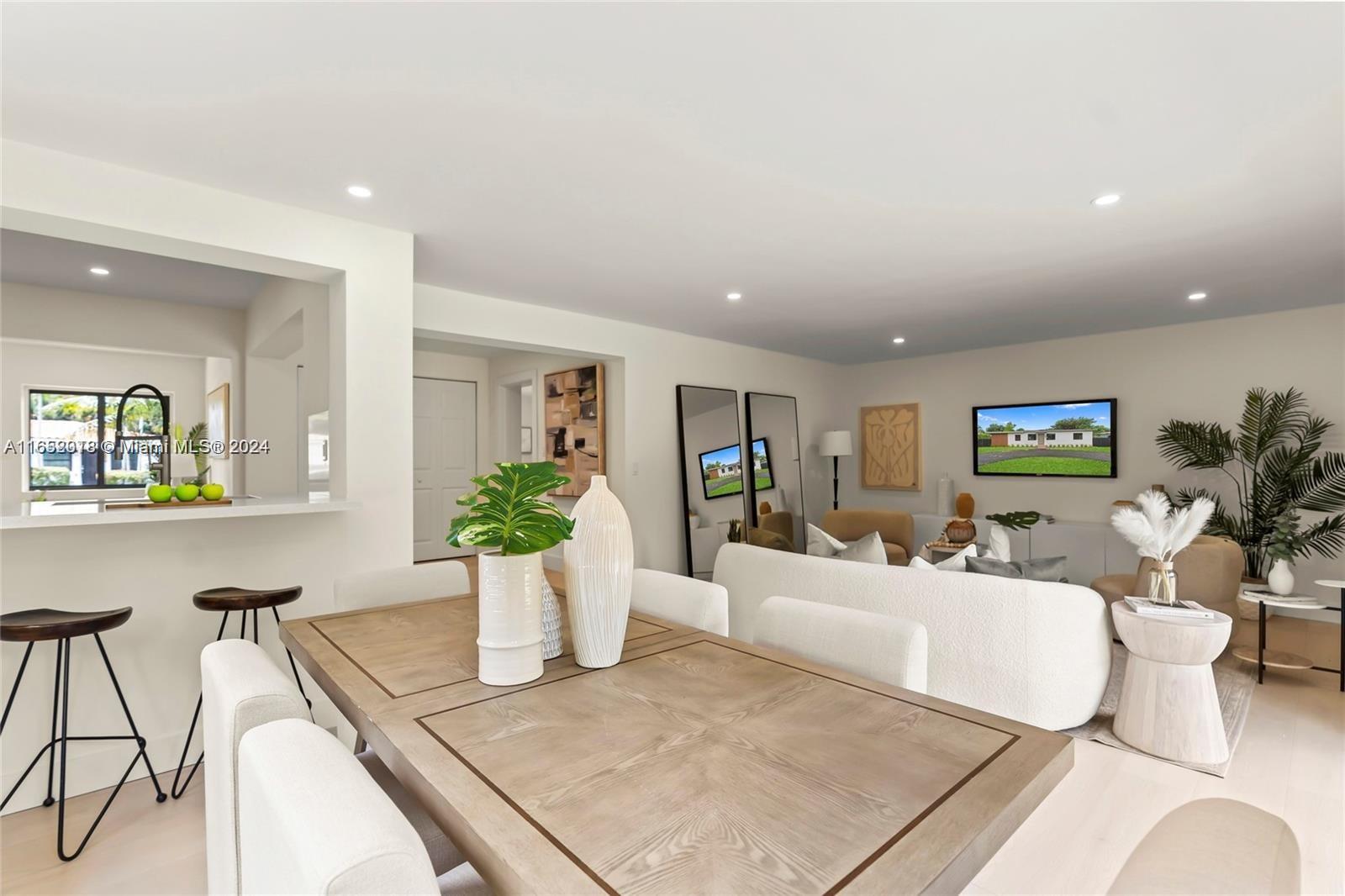 151 Northwest 146th Street Miami, FL 33168 - Photo 15 of 35 a living room with furniture and potted plant