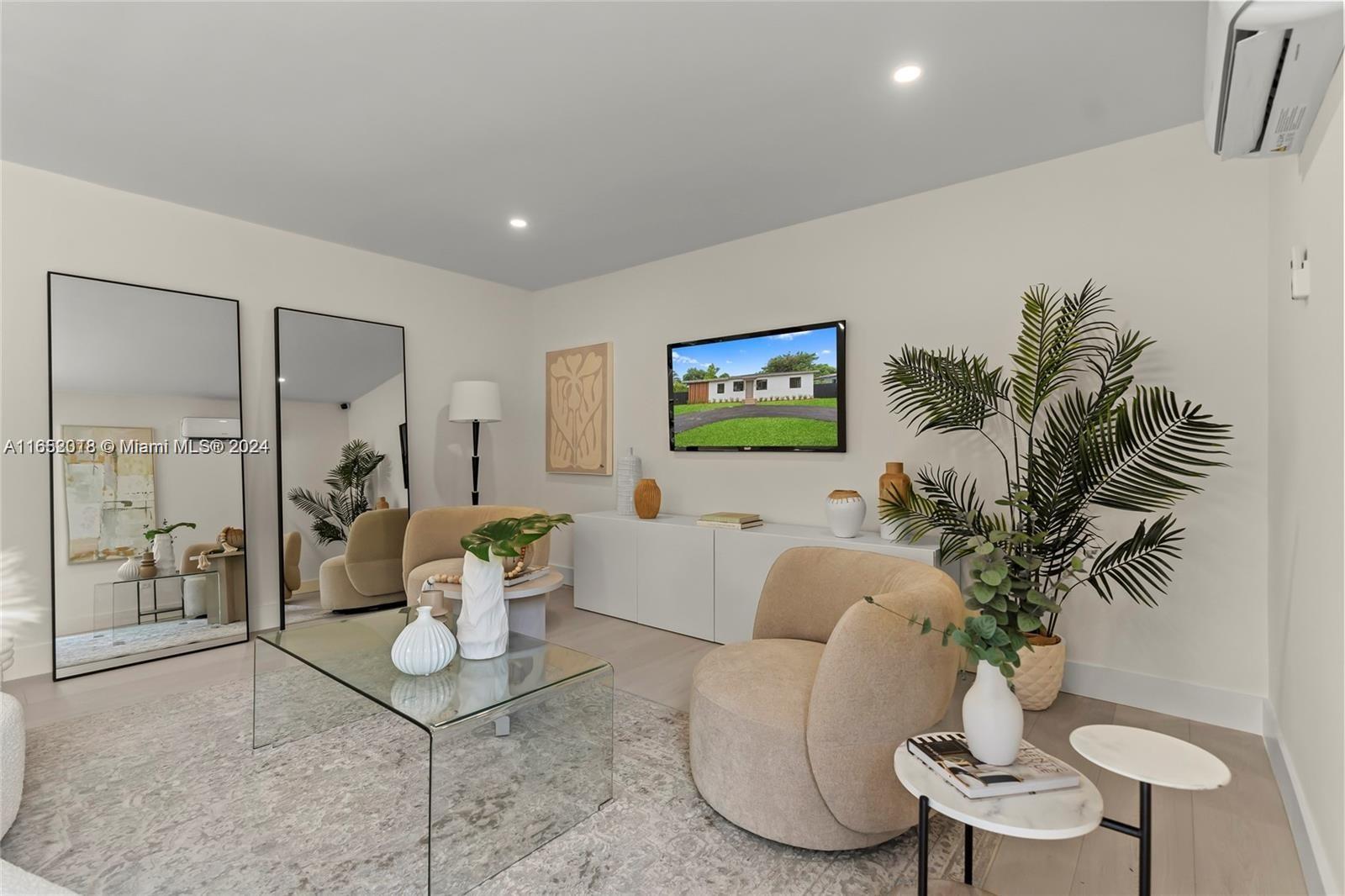 151 Northwest 146th Street Miami, FL 33168 - Photo 16 of 35 a living room with furniture potted plant and a chandelier