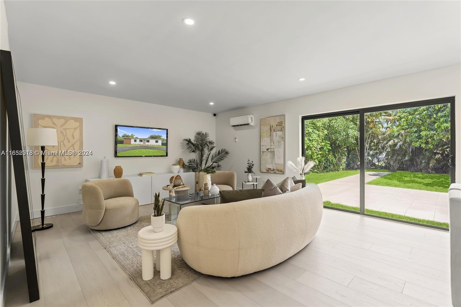 151 Northwest 146th Street Miami, FL 33168 - Photo 19 of 35 a living room with furniture and a large window
