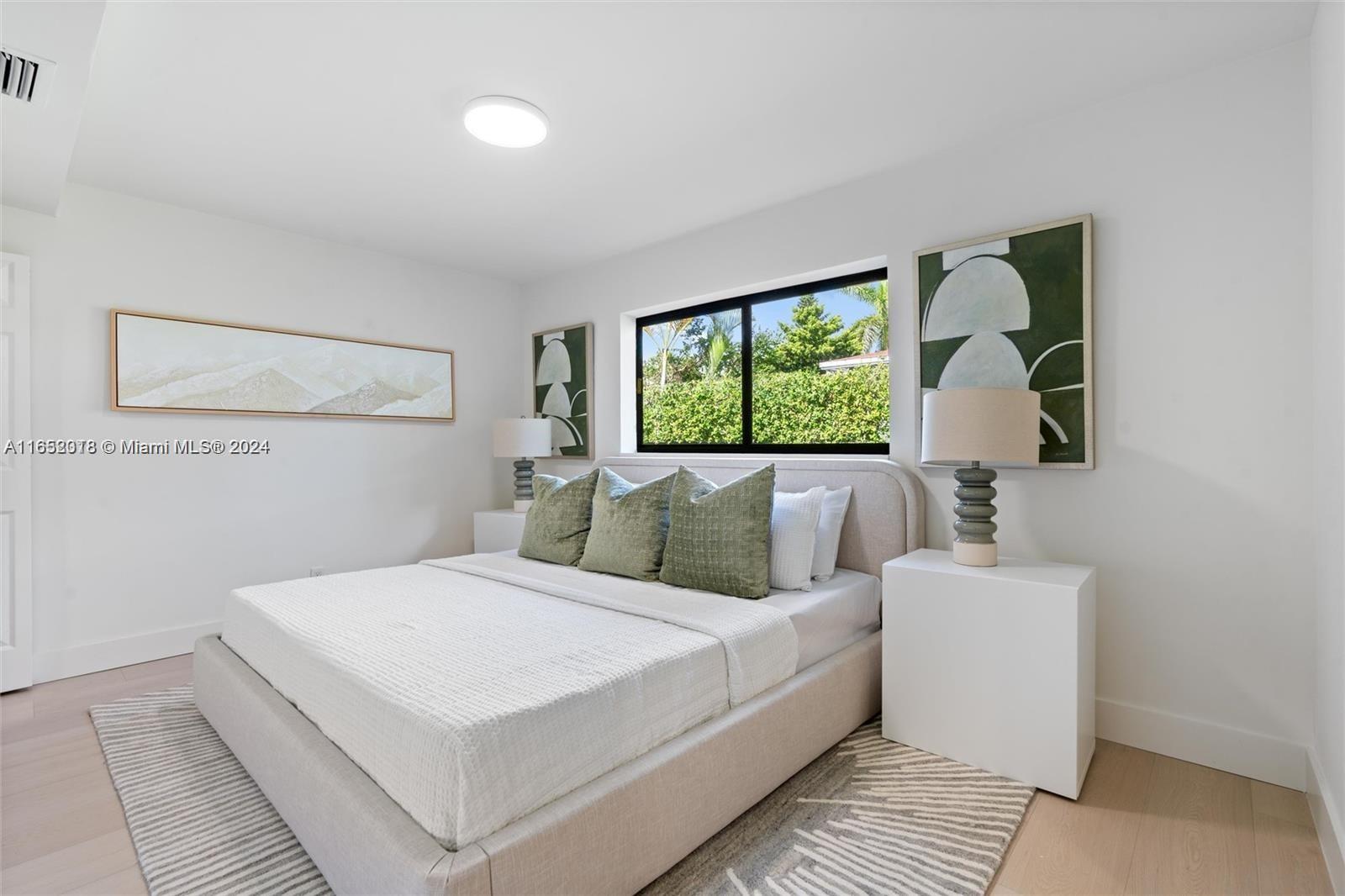 151 Northwest 146th Street Miami, FL 33168 - Photo 20 of 35 a bedroom with a large bed and a window