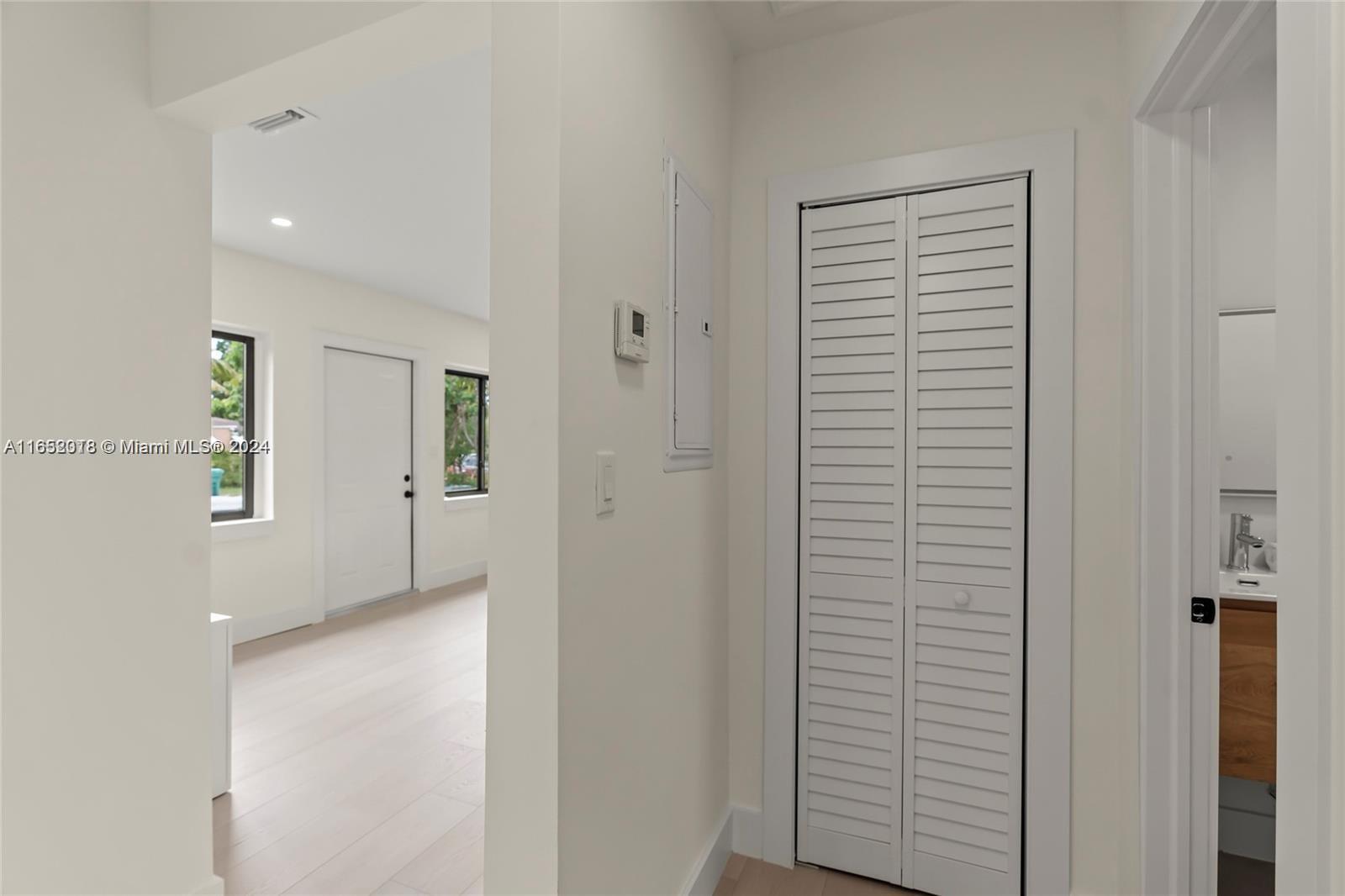 151 Northwest 146th Street Miami, FL 33168 - Photo 23 of 35 a view of a hallway with closet and a window